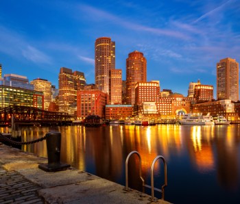 Boston harbor with cityscape and skyline on sunset